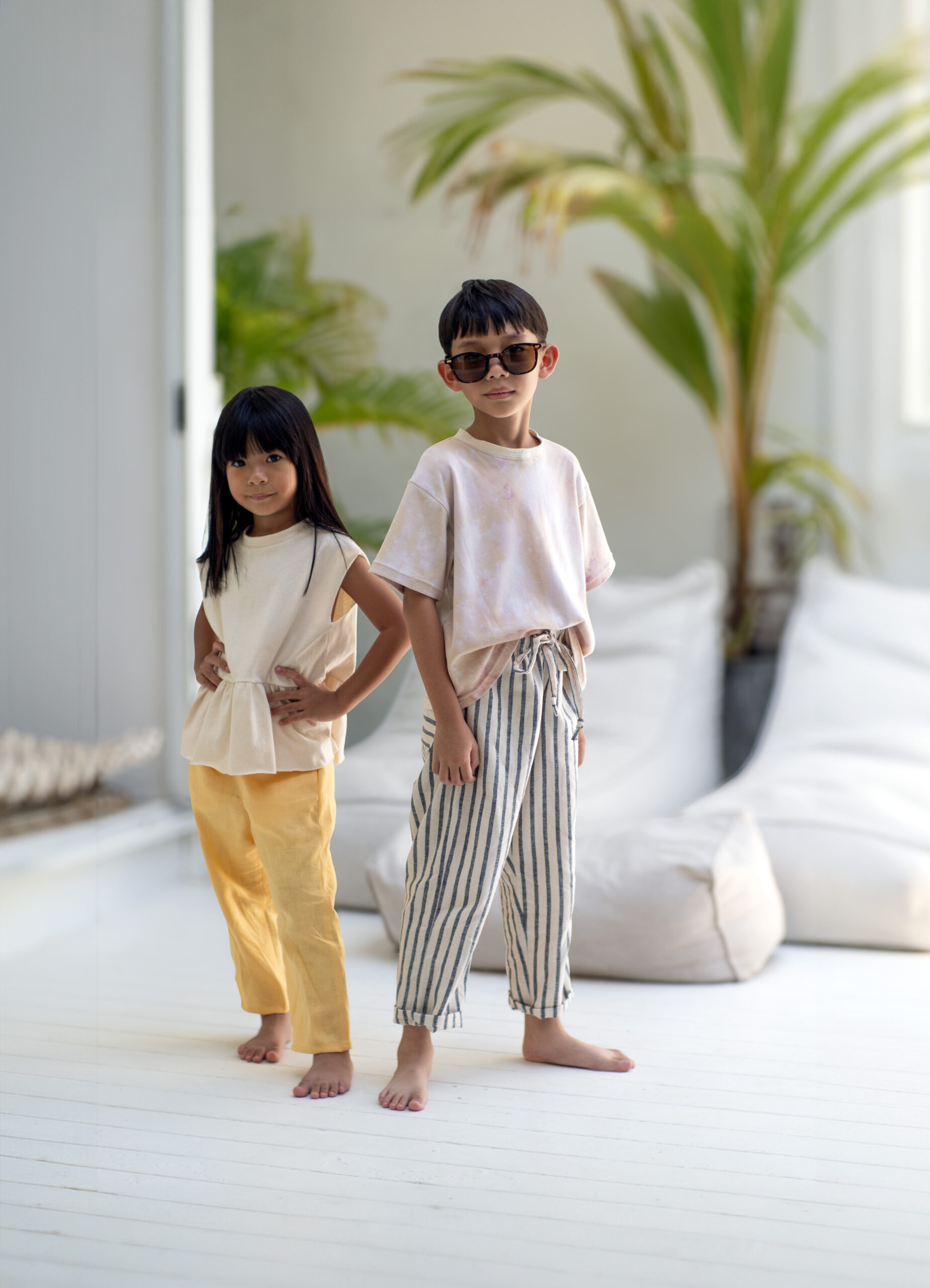 a girl and a by wearing each a pair of lazy pants for kids